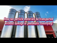How can particle materials be transported without damage in pneumatic conveying